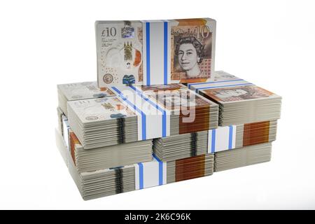 Pile pile di denaro del Regno Unito pile di pile di british Polymer £10 banconote pacchi di dieci sterline Foto Stock