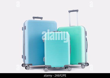 Valigia Blue Mint Green isolata su bagagli da vacanza con sfondo pastello Foto Stock