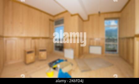 Costruzione interna di un nuovo progetto di casa con pareti di sfondo luminoso. Stanza vuota luminosa e sfocata senza mobili per lavori di ristrutturazione Foto Stock