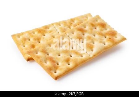 Cracker posti uno sopra l'altro su uno sfondo bianco. Foto Stock