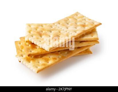 Cracker posti uno sopra l'altro su uno sfondo bianco. Foto Stock
