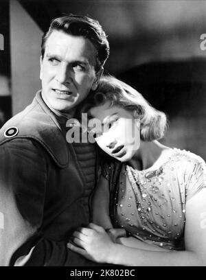 Leslie Nielsen & Anne Francis Film: Forbidden Planet (USA 1956) personaggi: Comandante J. Adams, Altaira 'alta' Morbius regista: Fred M.Wilcox 23 marzo 1956 **AVVERTENZA** questa fotografia è solo per uso editoriale ed è copyright di MGM e/o del fotografo assegnato dalla Film o dalla Production Company e può essere riprodotta solo da pubblicazioni in concomitanza con la promozione del film di cui sopra. È richiesto un credito obbligatorio a MGM. Il fotografo deve essere accreditato anche quando è noto. Nessun uso commerciale può essere concesso senza autorizzazione scritta da parte della Film Company. Foto Stock