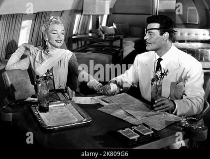 Marilyn Monroe & Alexander D'Arcy Film: Come sposare Un Millionaire (USA 1953) personaggi: Pola Debevoise & regista: Jean Negulesco 04 novembre 1953 **AVVERTENZA** questa fotografia è solo per uso editoriale ed è copyright di 20th CENTURY FOX e/o del fotografo assegnato dalla Film o dalla Società di produzione e può essere riprodotta solo da pubblicazioni in concomitanza con la promozione del film di cui sopra. È richiesto un credito obbligatorio a 20th CENTURY FOX. Il fotografo deve essere accreditato anche quando è noto. Nessun uso commerciale può essere concesso senza autorizzazione scritta da parte della Film Company. Foto Stock