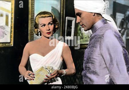 Lana Turner & Richard Burton Film: Le piogge di Ranchipur (USA 1955) personaggi: LADY EDWINA ESKETH, Dr. MAJOR RAMA SAFTI / Literaturverfilmung (basato sul libro di Louis Bromfield) regista: Jean Negulesco 14 dicembre 1955 **AVVERTENZA** questa fotografia è solo per uso editoriale ed è copyright di 20th CENTURY FOX e/o del fotografo assegnato dalla Film o dalla Società di produzione e può essere riprodotta solo da pubblicazioni in concomitanza con la promozione del film di cui sopra. È richiesto un credito obbligatorio a 20th CENTURY FOX. Il fotografo deve essere accreditato anche quando è noto. Nessuna commutazione Foto Stock