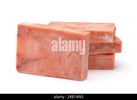 Stack di blocchi di filetto di salmone crudo congelato isolato su bianco Foto Stock