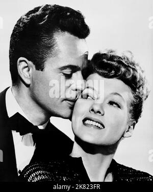 Larry Parks & Evelyn Keyes Film The Jolson Story (1949) personaggi: Al Jolson & Julie Benson regista: Alfred E. Green 10 ottobre 1946 **ATTENZIONE** questa fotografia è ad uso esclusivamente editoriale ed è copyright della COLUMBIA e/o del fotografo assegnato dalla Film o Production Company e può essere riprodotta solo da pubblicazioni in concomitanza con la promozione del suddetto Film. È richiesto un credito obbligatorio a COLUMBIA. Il fotografo deve essere accreditato anche se conosciuto. Nessun uso commerciale può essere concesso senza l'autorizzazione scritta di The Film Company. Foto Stock
