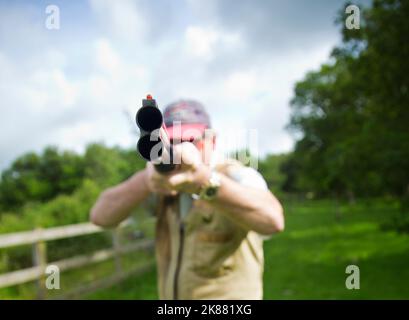 puntamento di una pistola a spruzzo Foto Stock