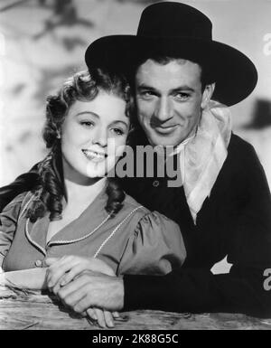 Doris Davenport & Gary Cooper personaggi: Jane Ellen Mathews & Cole Harden The Westerner (USA 1940) / Titel Auch: 'In Die Falle Gelockt' regista: William Wyler 05 settembre 1940 **AVVERTENZA** questa fotografia è solo per uso editoriale ed è copyright della COMAPNY DI SAMUEL GOLDWYN e/o del fotografo assegnato dalla Film o dalla Production Company e può essere riprodotta solo da pubblicazioni in concomitanza con la promozione del film di cui sopra. È richiesto un credito obbligatorio alla COMAPNY DI SAMUEL GOLDWYN. Il fotografo deve essere accreditato anche quando è noto. Non può essere concesso alcun uso commerciale Foto Stock