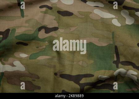 Forza armata multicolore tessuto mimetizzato sfondo texture. Foto Stock