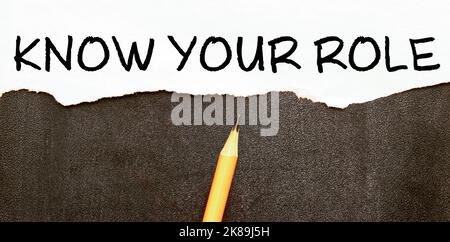 Segno di testo che mostra le parole scritte a mano conoscere il vostro ruolo. Foto Stock
