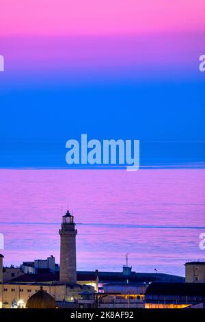 Il faro della Lanterna di Trieste al tramonto, Trieste Foto Stock