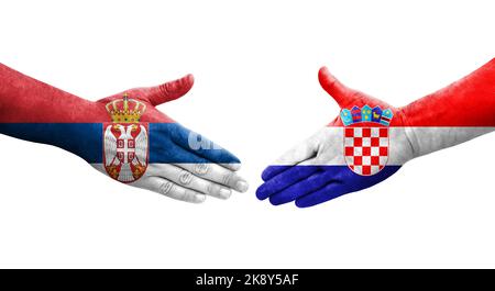 Stretta di mano tra Croazia e Serbia bandiere dipinte sulle mani, immagine trasparente isolata. Foto Stock