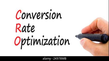 Simbolo di ottimizzazione del tasso di conversione CRO. Concetto di parole CRO tasso di conversione ottimizzazione su uno sfondo bianco bello. Mano uomo d'affari. Business CR Foto Stock