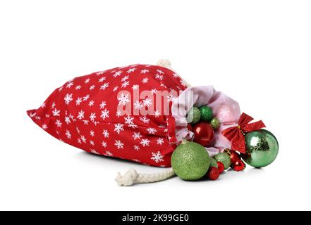 Borsa Babbo Natale con decorazioni natalizie su sfondo bianco Foto Stock