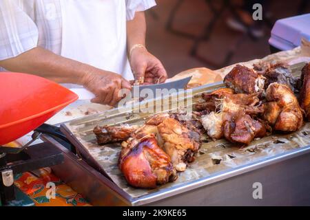 Un'azienda che vende carnitas di maiale, cibo tradizionale dal Messico Foto Stock