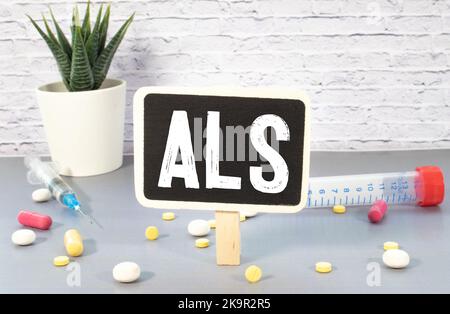 La parola ALS sul display di un tablet. Foto Stock