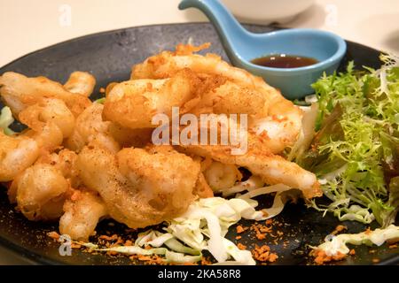 Calamari fritti cinesi in pastella, Hong Kong, Cina. Foto Stock