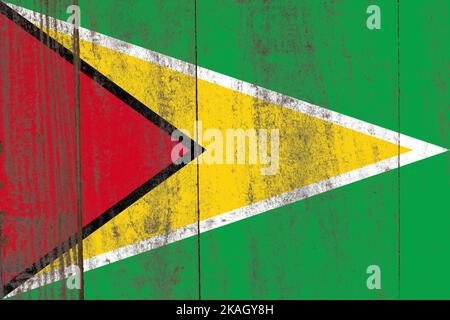 Bandiera della Guyana dipinta su un vecchio sfondo di legno danneggiato Foto Stock