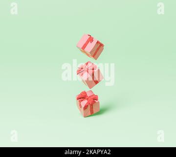 3D resa di scatole regalo simili avvolte in carta con nastri rossi che si levitano su sfondo verde Foto Stock