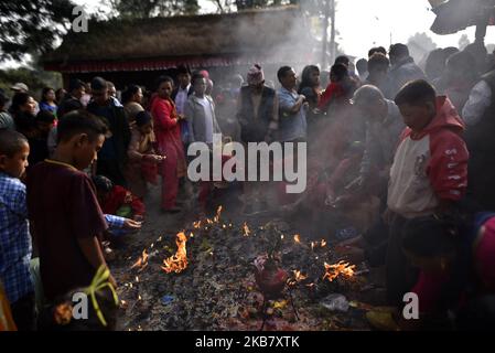 Nepalese devotees offering fragrances sticks traditional instruments during the tenth day of Dashain Durga Puja Festival in Bramayani Temple, Bhaktapur, Nepal on Tuesday, October 08, 2019. Dashain is the most auspicious and biggest celebrated festival in Nepal, which reflects age old traditions and the devotion of the Nepalese towards Goddess Durga. (Photo by Narayan Maharjan/NurPhoto) Stock Photo