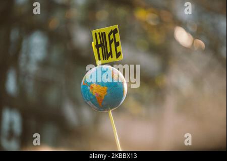 Help Sign at climate protest ''Friday for Future'' in Cologne, Germany, on 29 November 2019. 12000 people take part at the demonstration. (Photo by Ying Tang/NurPhoto) Stock Photo