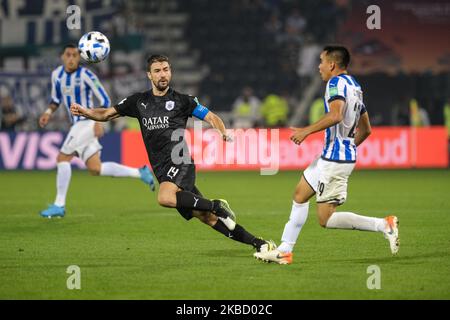 Carlos Rodríguez sprays the ball beyond Gabi during the FIFA Club World Cup 2nd round match between Monterrey and Al-Sadd Sports Club at Jassim Bin Hamad Stadium on December 14, 2019 in Doha, Qatar. (Photo by Simon Holmes/NurPhoto) Stock Photo