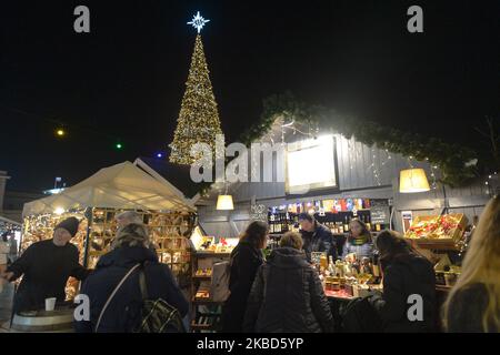 A view of Christmas tree and Christmas Market outside Krakow's main train station and Galeria Krakowska shoping mall. On Monday, December 16, 2019, in Krakow, Lesser Poland Voivodeship, Poland. (Photo by Artur Widak/NurPhoto) Stock Photo