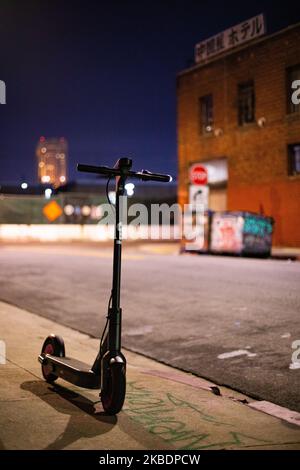 An electric scooter rental awaits customers at night in downtown Los Angeles, United States, on December 28, 2017. (Photo by John Fredricks/NurPhoto) Stock Photo