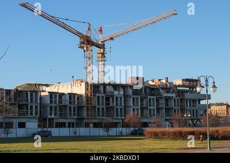 Giant cranes over the new block of flats estate construction site are seen in Tczew, Poland on 5 January 2020 (Photo by Michal Fludra/NurPhoto) Stock Photo