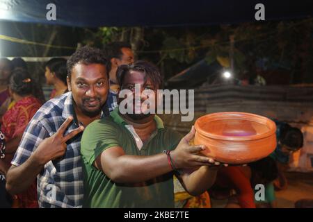 People purchase clay pots to be used for cooking pongala on the night of the ninth day of the 10 day-long Attukal Pongala Mahotsavam Festival in the city of Thiruvananthapuram (Trivandrum), Kerala, India, on February 18, 2019. The Attukal Pongala Mahotsavam Festival is celebrated by millions Hindu women each year. (Photo by Creative Touch Imaging Ltd./NurPhoto) Stock Photo