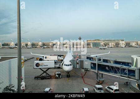 A wide body Airbus A340 docked at the gate and loaded with supplies from the other side for long haul flight. Early morning airplane traffic movement of Lufthansa aircraft with their logo visible on the tarmac and docked via jetbridge or air bridge at the terminal at Munich MUC EDDM international airport in Bavaria, Germany, Flughafen München in German. Deutsche Lufthansa DLH LH is the flag carrier and largest airline in Germany using Munich as one of their two hubs. Lufthansa is a Star Alliance aviation alliance member. January 26, 2020 (Photo by Nicolas Economou/NurPhoto) Stock Photo