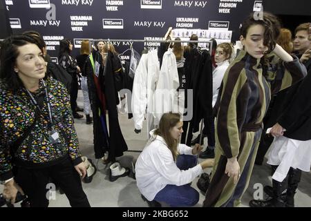 Models prepare backstage during the Ukrainian Fashion Week FW 20-21 in Kyiv, Ukraine, on 02 February, 2020. The Ukrainian fashion week with the presentation of collections of Ukrainian and international designers is held from February 1 to 5, 2020. (Photo by STR/NurPhoto) Stock Photo