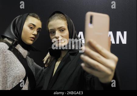 Models pose for a selfie backstage, during the Ukrainian Fashion Week FW 20-21 in Kyiv, Ukraine, on 05 February, 2020. The Ukrainian fashion week with the presentation of collections of Ukrainian and international designers is held from February 1 to 5, 2020. (Photo by STR/NurPhoto) Stock Photo