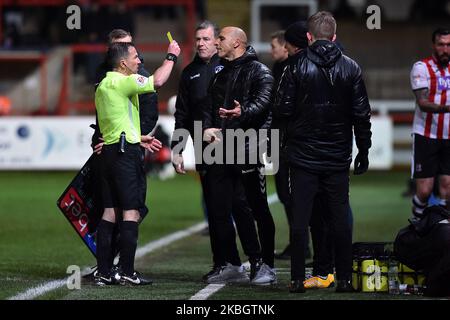 Dino Maamria (manager) of Oldham Athletic is booked by referee Keith Stroud during the Sky Bet League 2 match between Exeter City and Oldham Athletic at St James' Park, Exeter on Tuesday 11th February 2020. (Photo by Eddie Garvey/MI News/NurPhoto) Stock Photo