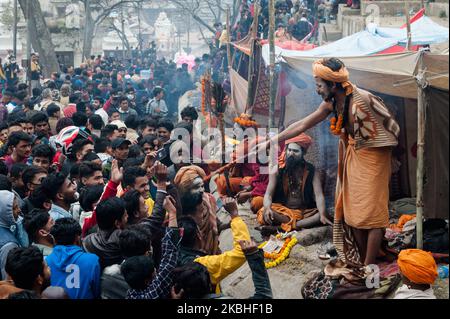 Large crowds of hindu devotees gather to receive a blessing from holy man (sadhu) at the Pashupatinath temple complex, one of the holiest shrines of the Hindus as well as UNESCO Heritage Site, on the day of Maha Shivaratri Festival on 21 February, 2020 in Kathmandu, Nepal. Hundreds of thousands of devotees from across Nepal and India are expected to visit the Pashupatinath Temple to celebrate Maha Shivaratri by offering special prayers and fasting to worship Lord Shiva. (Photo by WIktor Szymanowicz/NurPhoto) Stock Photo