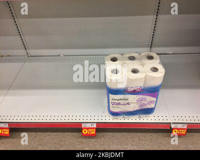 Almost empty shelves of toilet paper seen in a grocery store as Canadians followed the instructions of Canada's Health Minister Patty Hajdu to stock up on supplies to prepare in case of a novel coronavirus (COVID-19) outbreak as seen in Toronto, Ontario Canada on March 04, 2020. Following Canada's health minister encouraging Canadians to stockpile supplies in case of a coronavirus outbreak, stores across the country are faced with empty shelves as face masks, disinfectant and toilet paper shortages have been reported. (Photo by Creative Touch Imaging Ltd./NurPhoto) Stock Photo