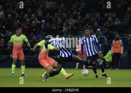 Sergio Aguero of Manchester City shoots past Dominic Iorfa to put them into a 1-0 lead during the FA Cup Fifth Road match between Sheffield Wednesday and Manchester City at Hillsborough, Sheffield on Wednesday 4th March 2020. (Photo by MI News/NurPhoto) Stock Photo