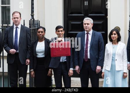 Chancellor of the Exchequer Rishi Sunak holds the budget box as he stands together with his treasury team including Chief Secretary to the Treasury Stephen Barclay (2R) outside 11 Downing Street in central London ahead of the announcement of the Spring Statement in the House of Commons on 11 March, 2020 in London, England. (Photo by WIktor Szymanowicz/NurPhoto) Stock Photo