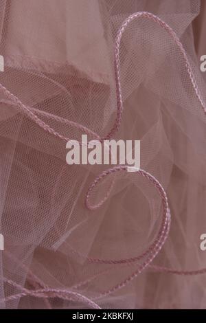 Fondo rosa polvere, tessuto, tessuto, colore alla moda. Foto Stock