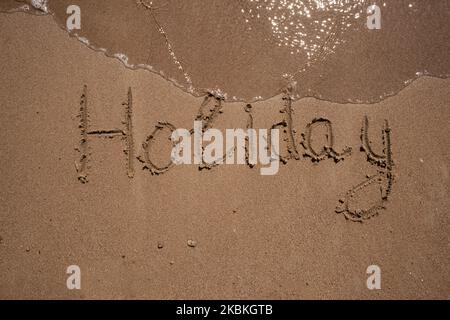 L'iscrizione vacanza sulla sabbia, sul mare e l'onda, copia spazio Foto Stock