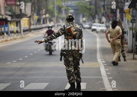 Security personnel stops offenders, during India government-imposed lockdown as a preventive measure against the COVID-19 coronavirus, in Guwahati, Assam, India on March 26, 2020. (Photo by David Talukdar/NurPhoto) Stock Photo