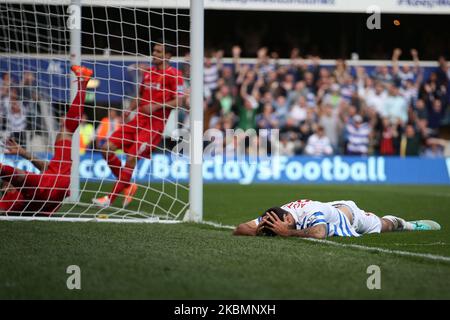 Queens Park Rangers Forward Charlie Austin falls to the floor as he narrowly misses in the first half during the Barclays Premier League Match between Queens Park Rangers & Liverpool at Loftus Road, London on Sunday October 19th 2014 (Photo by MI News/NurPhoto) Stock Photo