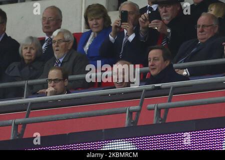 HRH Prince William looks on pensively as Greg Dyke (c), the Chairman of the Football Association and David Cameron (R), the Bristish Prime Minister share a joke during the International Friendly match between England & France at Wembley Stadium on Tuesday 17th November2015. (Photo by Ryan Dinham/MI News/NurPhoto) Stock Photo