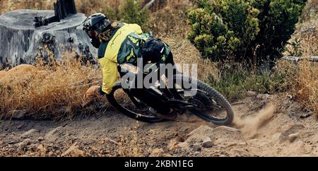 Mountain bike speed, dust on ground from fast drift turn and race, rally or competition outdoor. Extreme sports cycling, sand dirt rocks and cyclist Stock Photo