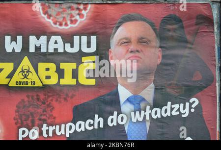 An image of Andrzej Duda, the current President of Poland, seen on a billboard, titled 'The May Election Can Kill. Walking Over Corpses To Power?'. This billboard campaign, founded by internet donations, is led by the controversial foundation (Polish name: Spontaniczny Sztab Obywatelski), headed by Ludmila Kozlowska. The Presidential Election is scheduled to be held in Poland on May 10, 2020. During the COVID-19 pandemic the government's plan of holding the election as originally scheduled during the pandemic has been heavily criticised. However, the Law and Justice ruling party (PIS) is still Stock Photo