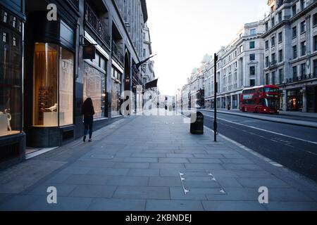 A man walks along a near-deserted Regent Street in London, England, on May 6, 2020. Britain is now well into its seventh week of coronavirus lockdown, although a slight easing of the restrictions is expected to be announced this Sunday, along with a schedule for further 'easements' over the coming months. Covid-19 deaths across the country have meanwhile reached 30,076 according to today's figures from the UK's Department of Health and Social Care. The figure is currently considered to be the highest in Europe, though experts have cautioned that it may be some months before accurate comparison Stock Photo