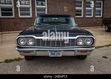 Des Moines, IA - July 01, 2022: High perspective front view of a 1964 Chevrolet Impala Convertible at a local car show. Stock Photo