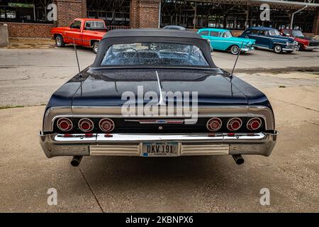 Des Moines, IA - July 01, 2022: High perspective rear view of a 1964 Chevrolet Impala Convertible at a local car show. Stock Photo