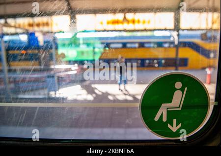 A sign inside on one of the NS trains in Den Bosch, The Netherlands that points in which seat you can sit, during the Corona situation, on May 15th, 2020. (Photo by Romy Arroyo Fernandez/NurPhoto) Stock Photo