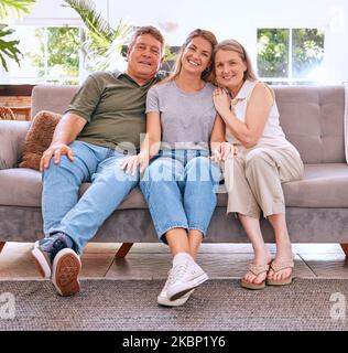 Family, portrait and grandparents with woman on sofa in home, bonding and enjoying quality time together. Smile, relax and daughter, grandma and Foto Stock